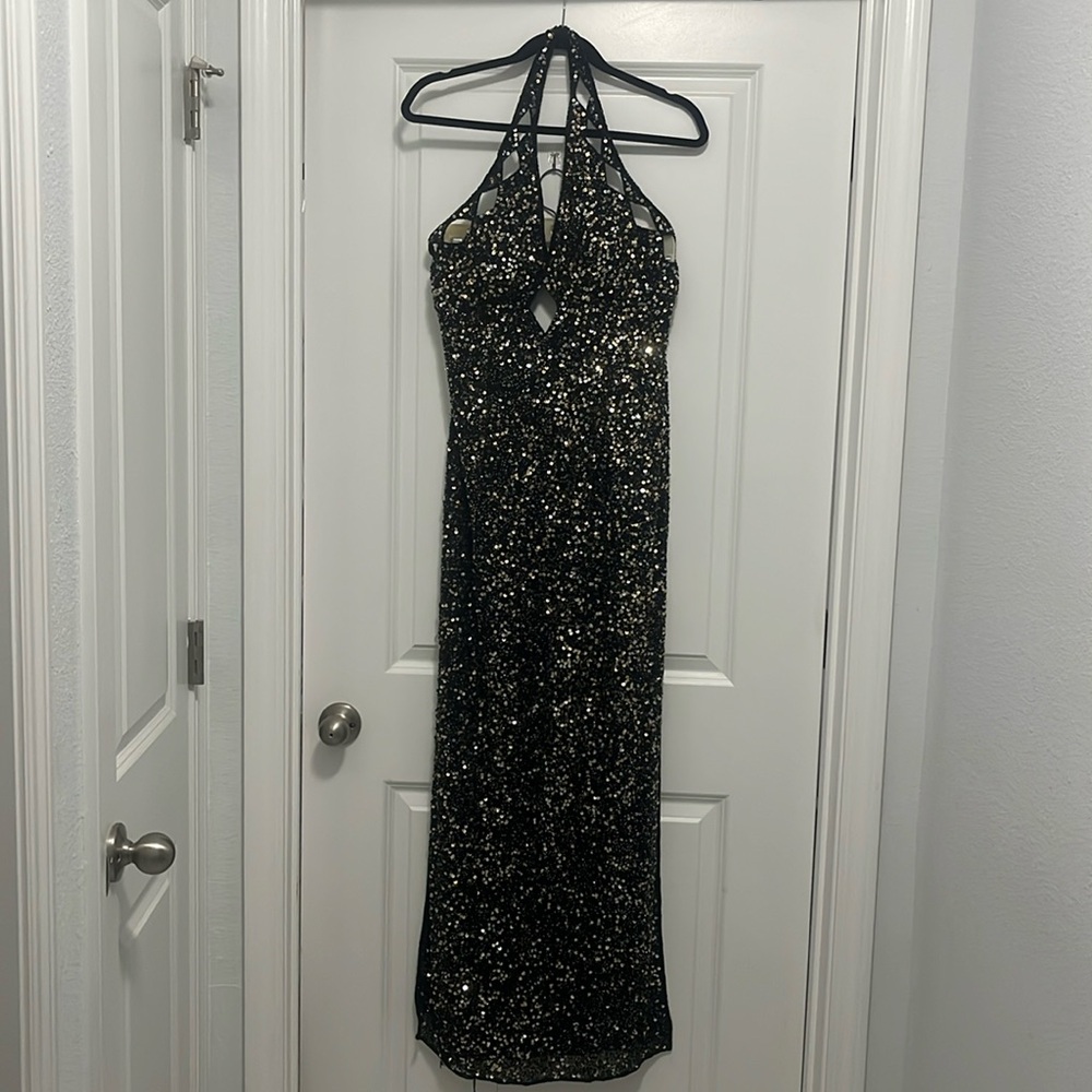 Women’s gown: Black with silver and gold sequences